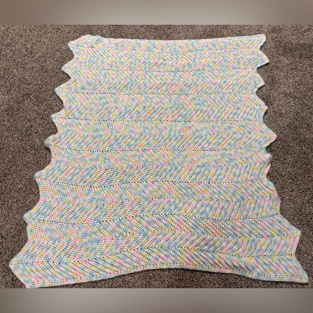 hand-crocheted baby blanket with a pastel chevron pattern 37” x 37”